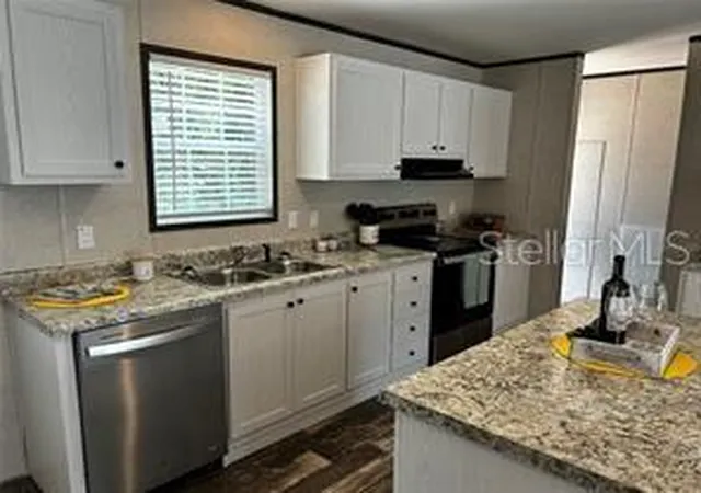 Photo 2 of Manufactured home for sale at 9494 SE 144th Place, Summerfield, FL 34491 | MLS# TB8388219 | Listing updated on 2026-04-13