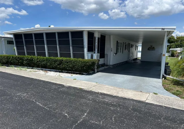 Photo 1 of Manufactured home for sale at 36 Thatch Palm St E, Largo, FL 33770 | MLS# TB8396188 | Listing updated on 2026-10-01