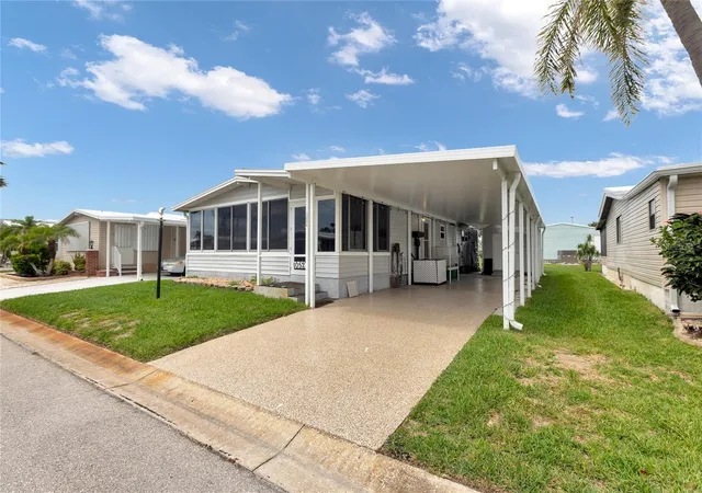 Photo 1 of Manufactured home for sale at 2100 Kings Hwy #1052, Port Charlotte, FL 33980 | MLS# C7511787 | Listing updated on 2026-10-22