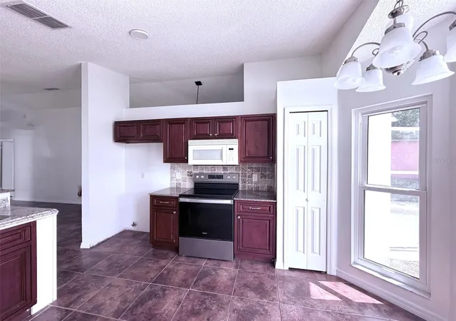 Photo 3 of Single family home for sale at 7219 Edgewater Shrs Ct, Orlando, FL 32810 | MLS# O6324605 | Listing updated on 2026-08-11