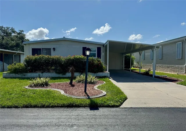 Photo 1 of Manufactured home for sale at 203 Estrada, North Port, FL 34287 | MLS# A4659090 | Listing updated on 2026-04-28