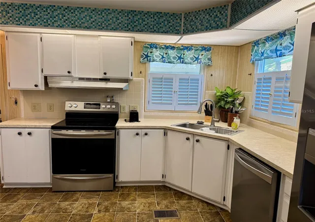 Photo 3 of Manufactured home for sale at 203 Estrada, North Port, FL 34287 | MLS# A4659090 | Listing updated on 2026-04-28