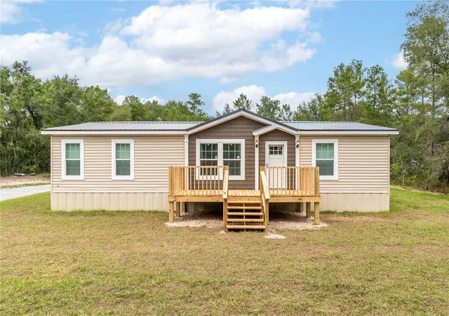 Photo 3 of Manufactured home for sale at 10865 Ne 220th Street, Fort Mc Coy, FL 32134 | MLS# OM710113 | Listing updated on 2026-06-29