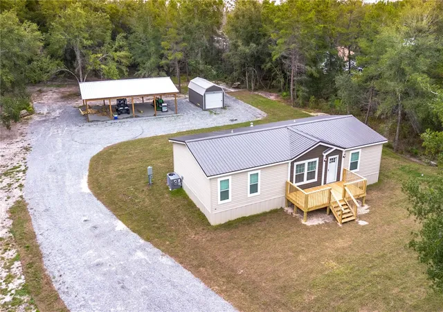 Photo 4 of Manufactured home for sale at 10865 NE 220th Street, Fort Mc Coy, FL 32134 | MLS# OM710113 | Listing updated on 2026-06-29