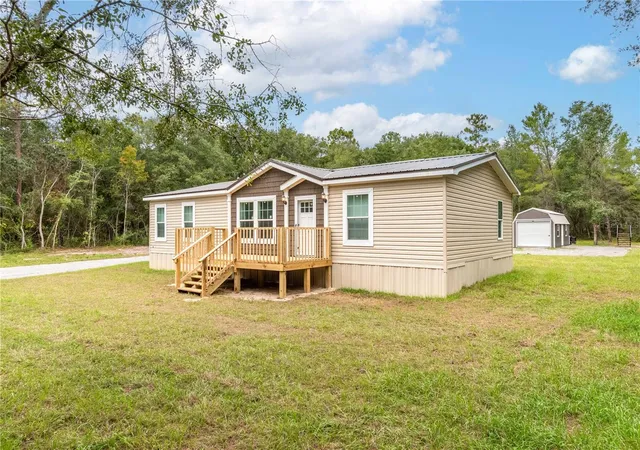 Photo 3 of Manufactured home for sale at 10865 NE 220th Street, Fort Mc Coy, FL 32134 | MLS# OM710113 | Listing updated on 2026-06-29