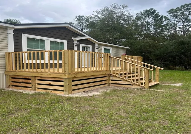 Photo 2 of Manufactured home for sale at 10865 Ne 220th Street, Fort Mc Coy, FL 32134 | MLS# OM710113 | Listing updated on 2026-06-29