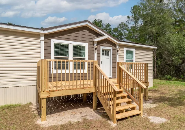 Photo 1 of Manufactured home for sale at 10865 Ne 220th Street, Fort Mc Coy, FL 32134 | MLS# OM710113 | Listing updated on 2026-06-29