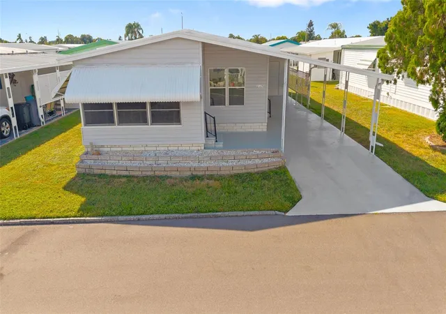 Photo 1 of Manufactured home for sale at 2127 Wailua Dr, Holiday, FL 34691 | MLS# TB8430560 | Listing updated on 2026-09-29