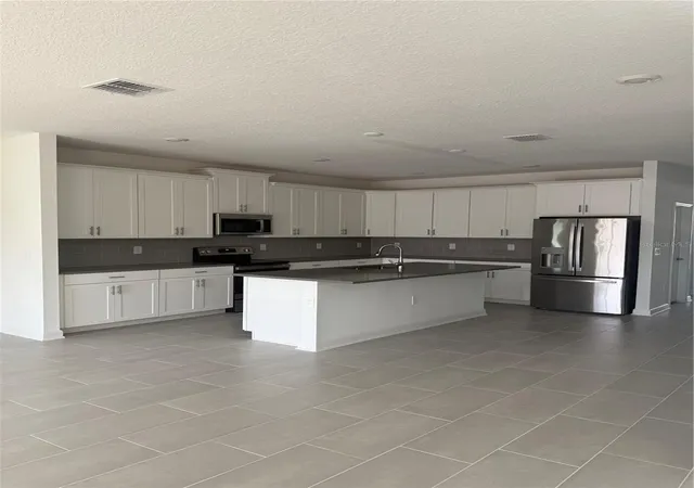 5th image of 1123 Kingsbarn St, Davenport, FL 33896 | MLS# O6350323