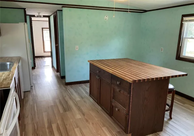 Photo 3 of Manufactured home for sale at 18057 SE 20th Place, Silver Springs, FL 34488 | MLS# OM712059 | Listing updated on 2026-09-14