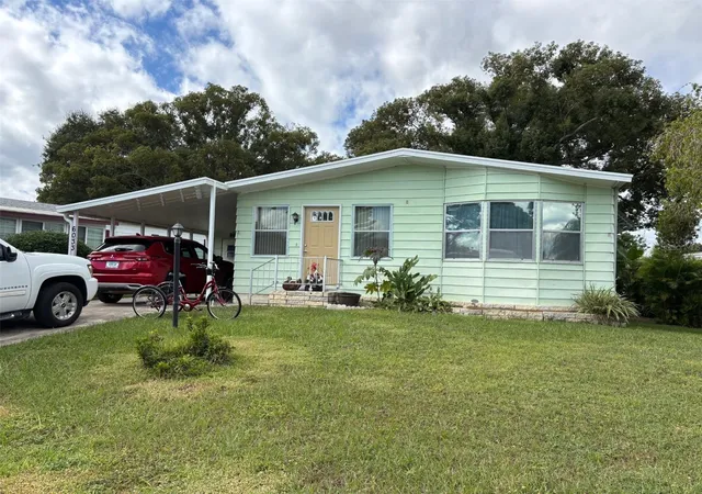 Photo 1 of Manufactured home for sale at 6033 Grand Oaks Dr Se, Winter Haven, FL 33884 | MLS# P4936903 | Listing updated on 2026-06-24