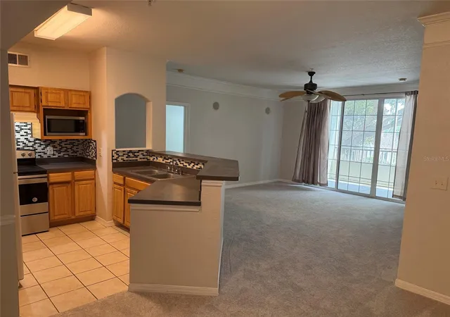Photo 3 of Condo for sale at 6685 Queens Borough Ave #207, Orlando, FL 32835 | MLS# O6360401 | Listing updated on 2026-09-12