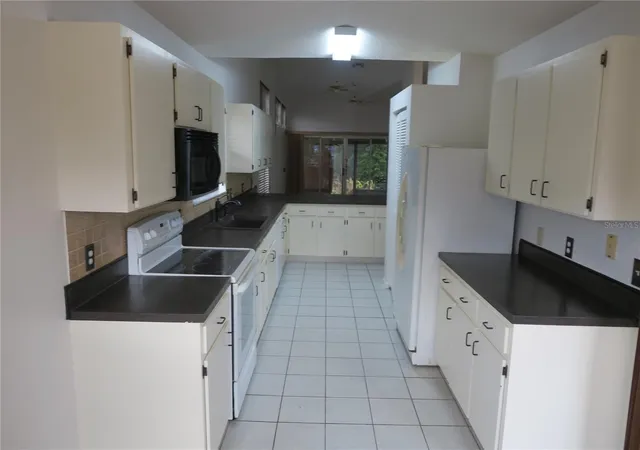 5th image of 32512 Oak Park Dr, Leesburg, FL 34748 | MLS# O6360997