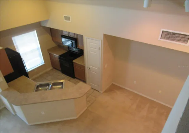 Listing Photo 4 - Condo for sale in building located at 5601 Rosehill Rd, Sarasota, FL 34233 - Unit #203