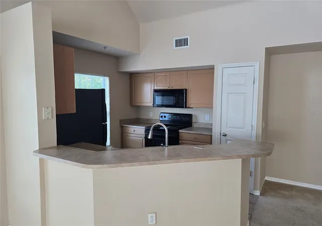 Listing Photo 2 - Condo for sale in building located at 5601 Rosehill Rd, Sarasota, FL 34233 - Unit #203