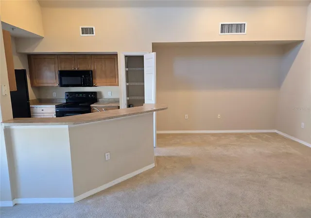 Listing Photo 5 - Condo for sale in building located at 5601 Rosehill Rd, Sarasota, FL 34233 - Unit #203