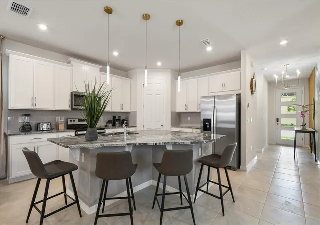 Photo 4 of Single family home for sale at 8903 Coconut Breeze Dr, Kissimmee, FL 34747 | MLS# O6365504 | Listing updated on 2026-07-05