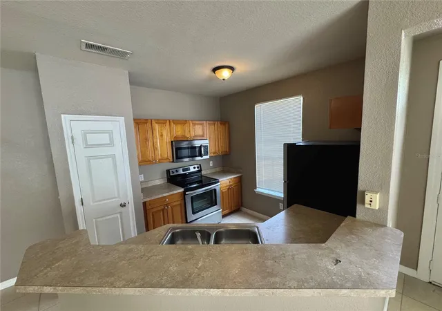 5th image of 9061 Lee Vis Blvd, Orlando, FL 32829