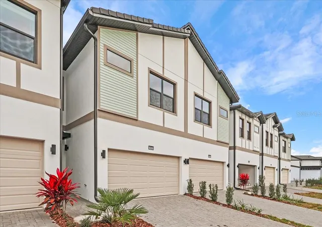 Photo 1 of Townhouse for sale at 10525 Ebb Tide Ln, Orlando, FL 32821 | MLS# O6368792 | Listing updated on 2026-01-15