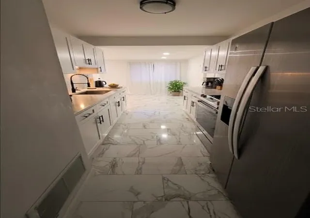 Photo 3 of Single family home for sale at 7714 W Powhatan, Tampa, FL 33615 | MLS# TB8461330 | Listing updated on 2026-08-06