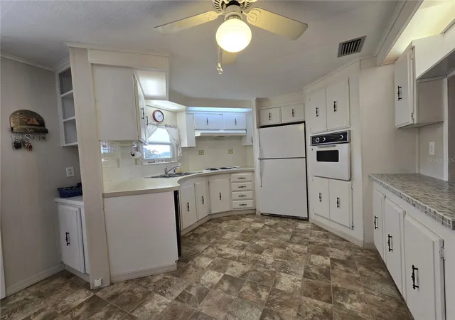 Photo 4 of Manufactured home for sale at 3450 N Citrus Cir #GE, Zellwood, FL 32798 | MLS# O6371935 | Listing updated on 2026-09-23