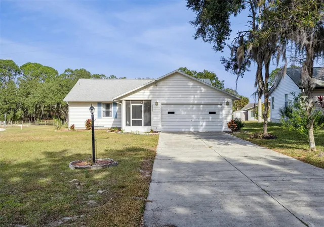 1st image of 1409 New Abbey Ave, Leesburg, FL 34788 | MLS# S5141380