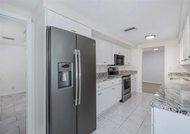 Photo 3 of Single family home for sale at 1148 Fernwood Dr, Holiday, FL 34690 | MLS# W7881931 | Listing updated on 2026-09-26