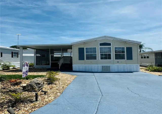 Photo 1 of Manufactured home for sale at 300 Royal Troon Loop, Davenport, FL 33837 | MLS# O6372745 | Listing updated on 2026-07-21