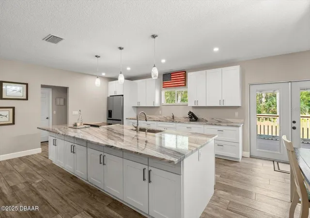 Photo 5 of Single family home for sale at 2995 Ragis Rd, Edgewater, FL 32132 | MLS# FC315297 | Listing updated on 2026-06-27