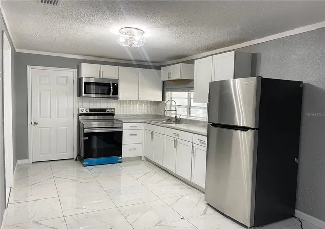 Photo 5 of Single family home for sale at 630 N Nashua Ave, Fort Meade, FL 33841 | MLS# O6374740 | Listing updated on 2026-09-04