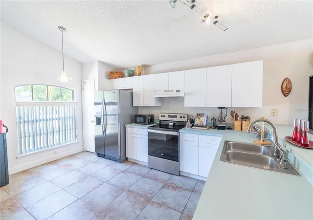 Photo 3 of Single family home for sale at 5501 Chatham Woods Ct, Orlando, FL 32808 | MLS# O6375450 | Listing updated on 2026-08-31