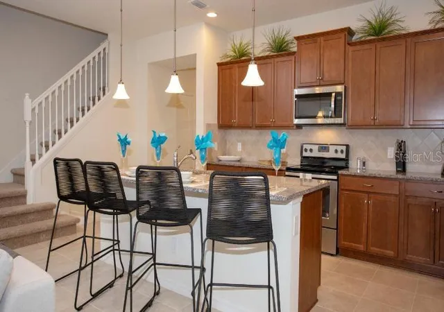 Photo 1 of Townhouse for sale at 8879 Geneve Ct, Kissimmee, FL 34747 | MLS# O6376223 | Listing updated on 2026-08-11