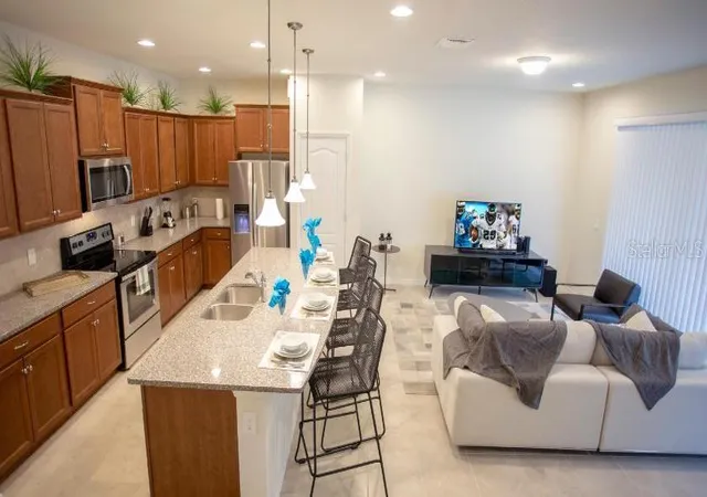 Photo 2 of Townhouse for sale at 8879 Geneve Ct, Kissimmee, FL 34747 | MLS# O6376223 | Listing updated on 2026-08-11