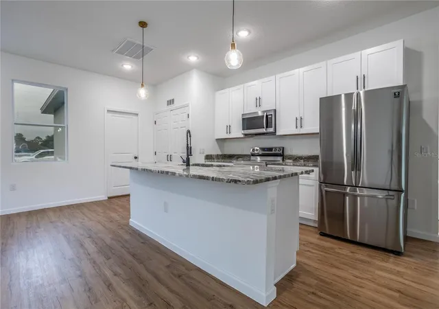 Photo 5 of Single family home for sale at 411 St Johns Ln, Kissimmee, FL 34759 | MLS# O6378041 | Listing updated on 2026-09-02