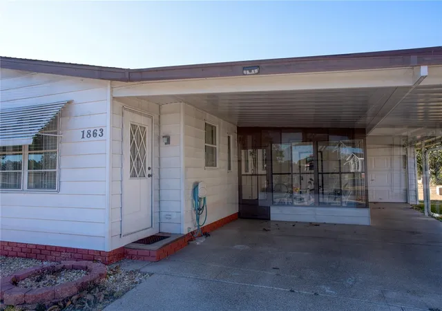 Photo 2 of Manufactured home for sale at 1863 W Schwartz Blvd, Lady Lake, FL 32159 | MLS# OM718202 | Listing updated on 2026-08-07