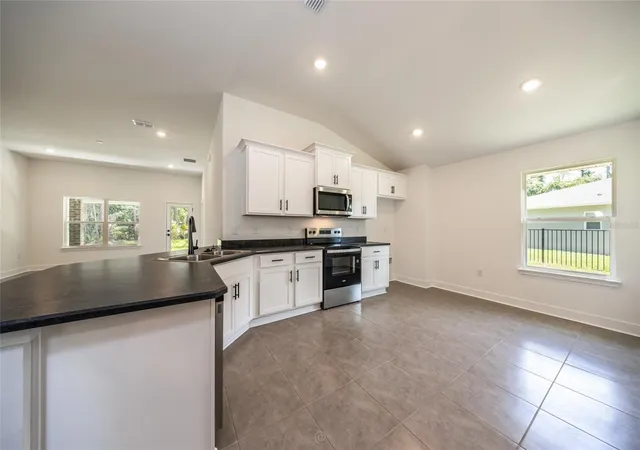 4th image of 77 Pickering Dr, Palm Coast, FL 32164 | MLS# FC316011