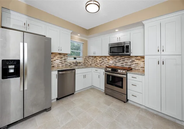 Photo 2 of Condo for sale at 2440 World Pkwy Blvd #38, Clearwater, FL 33763 | MLS# TB8475430 | Listing updated on 2026-09-16