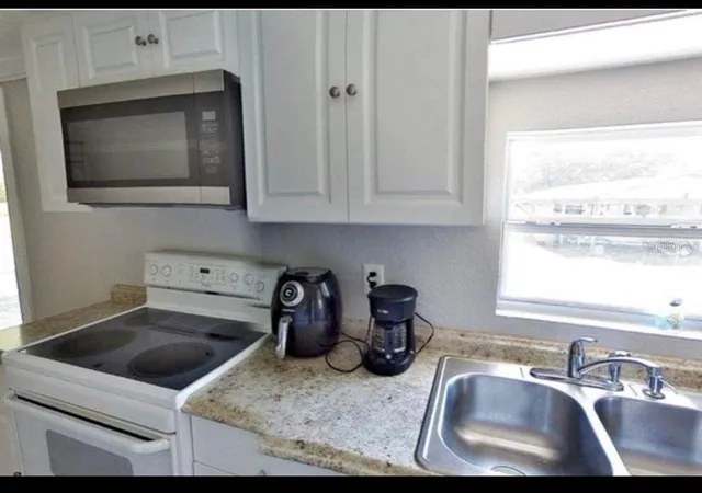 Photo 3 of Manufactured home for sale at 3215 Tucker Ave, Saint Cloud, FL 34772 | MLS# S5143755 | Listing updated on 2026-02-13