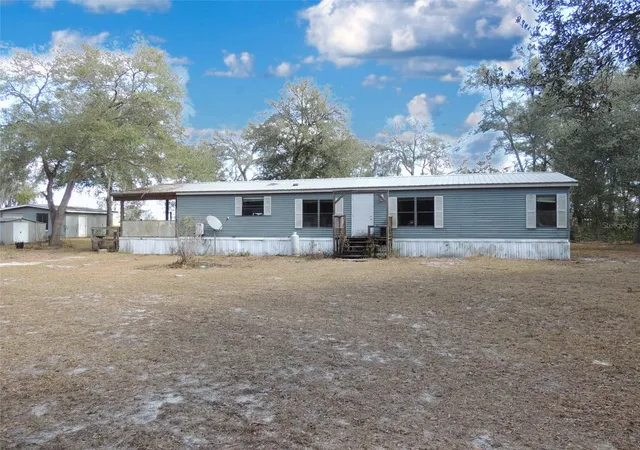 Photo 2 of Manufactured home for sale at 4551 Se 138th Terrace, Morriston, FL 32668 | MLS# OM719044 | Listing updated on 2026-10-01