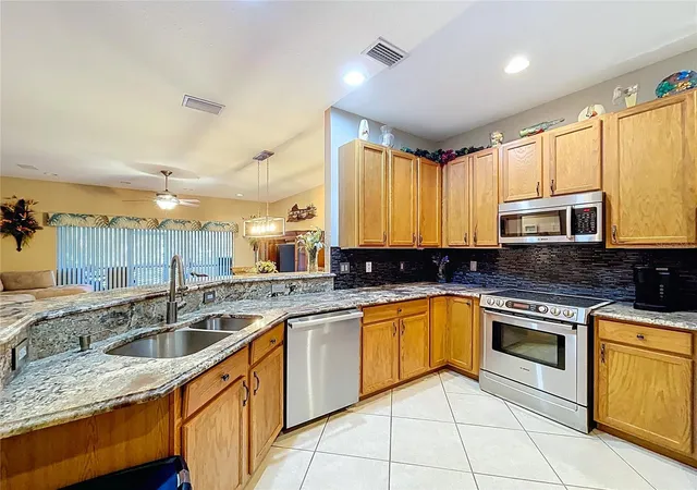 Photo 3 of Townhouse for sale at 11273 Kapok Grand Cir, Saint Petersburg, FL 33708 | MLS# TB8478866 | Listing updated on 2026-09-12