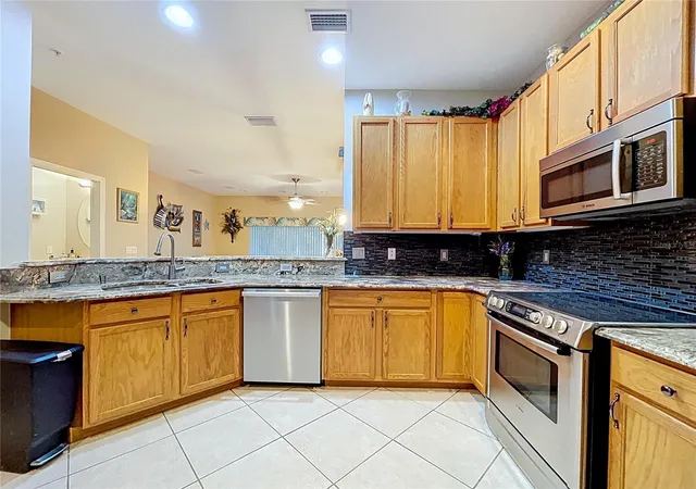 Photo 4 of Townhouse for sale at 11273 Kapok Grand Cir, Saint Petersburg, FL 33708 | MLS# TB8478866 | Listing updated on 2026-09-12