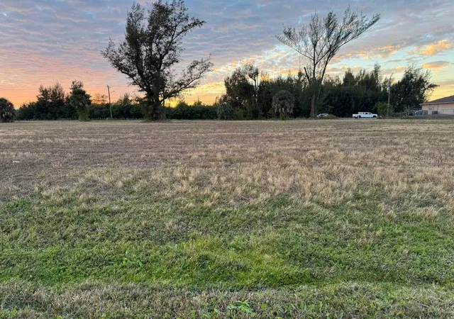 Photo 1 of Land for sale at 410 Sw 15th Place, Cape Coral, FL 33991 | MLS# O6385099 | Listing updated on 2026-03-20