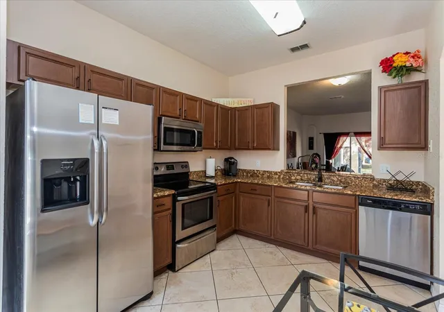 Photo 3 of Townhouse for sale at 232 La Mirage St, Davenport, FL 33897 | MLS# O6385997 | Listing updated on 2026-09-14