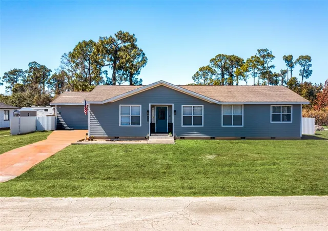 Photo 2 of Single family home for sale at 323 Greenwood Ave, Lehigh Acres, FL 33936 | MLS# O6386081 | Listing updated on 2026-04-27