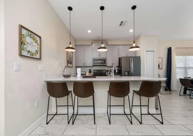 Photo 4 of Townhouse for sale at 8999 Cabot Cliffs Dr, Davenport, FL 33896 | MLS# O6387305 | Listing updated on 2026-08-17