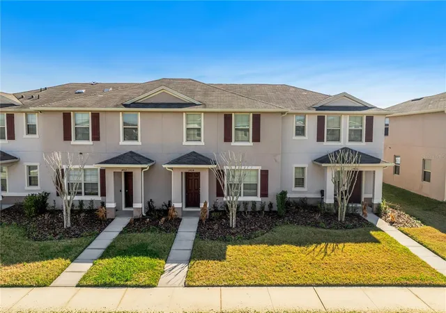 Photo 1 of Townhouse for sale at 1404 Dusty Stone Ln, Kindred, FL 34744 | MLS# O6387862 | Listing updated on 2026-06-26