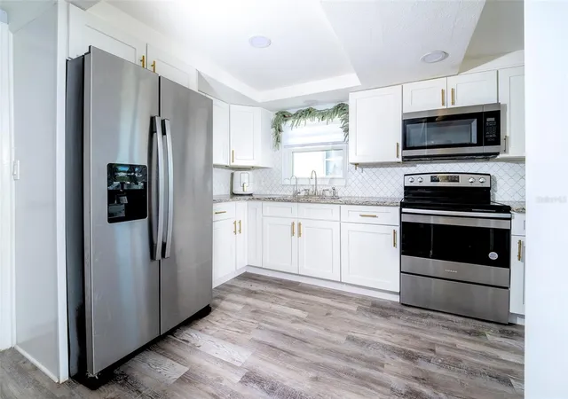 Photo 4 of Single family home for sale at 4301 Westwood Dr, Holiday, FL 34691 | MLS# TB8484815 | Listing updated on 2026-03-13