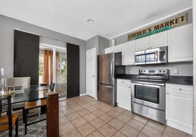 Photo 3 of Townhouse for sale at 4204 Plantation Cvs Dr, Orlando, FL 32810 | MLS# O6389416 | Listing updated on 2026-09-22