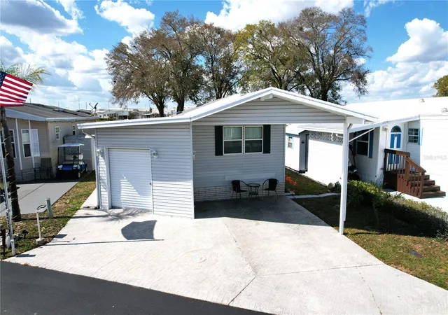 Photo 4 of Manufactured home for sale at 627 Arnold Palmer Dr, Davenport, FL 33837 | MLS# O6389451 | Listing updated on 2026-09-02