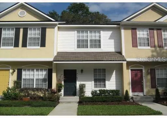 Photo 1 of Townhouse for sale at 4169 Plantation Cvs Dr, Orlando, FL 32810 | MLS# O6389523 | Listing updated on 2026-03-12